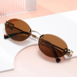 Gafas de sol ovaladas elegantes antideslumbrantes con borde cortado a la moda, gafas de sol sin montura Uv400 para hombre, gafas de conducción de viaje para mujer, Unisex