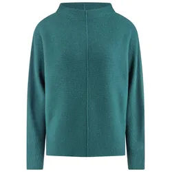 Le pull include turquoise