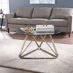 Stondon Round Cocktail Table by SEI Furniture in Champagne