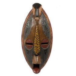 African wood mask, 'God Has Heard Me'