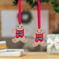 'Pair of Gingerbread Man-Shaped Hand-Painted Wood Ornaments'