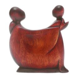 'Hand-Carved Suar Wood Sculpture with a Polished Finish'