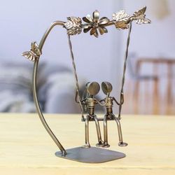 'Eco-Friendly Recycled Auto Part Statuette of Couple in Swing'