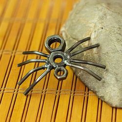 'Eco-Friendly Recycled Metal Figurine with Spider Motif'
