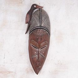 'Folk Art-Inspired Sese Wood African Mask with Bird Motif'