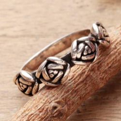 Rose Sophistication,'Sterling Silver Band Ring Crowned by Four Rose Accents'