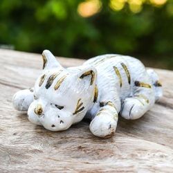 'Whimsical Hand-Painted Ivory and Brown Ceramic Cat Statuette'