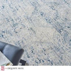 The Met X Exquisite Rugs Vintage Looms Light Blue/Blue Area Rug.