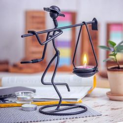 On my Way,'Modern Iron Tealight Holder of Man Carrying Weight in Black'