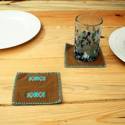 'Pair of Folk Art-Themed Brown and Turquoise Cotton Coasters'