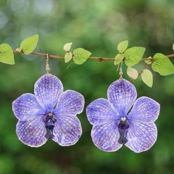 'Resin-Coated Purple Orchid Dangle Earrings with Golden Hooks'