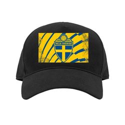 Barn-Caps | Justerbar Caps for Barn Svart Barn Ren skjold i blått og gult med korsmotiv inspirert av fotball-VM 2026 og svensk stolthet Ren skjold i
