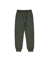 Champion Legacy C-Tech W (117477) - TCV Stretch Poly-Cotton Interlock Rib Cuff spodnie dresowe, zielony, M damski FW24, Zielony Las (Fon), M