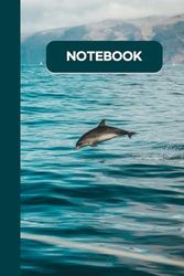 Notebook: The design of this notebook is a dolphin jumping on the sea