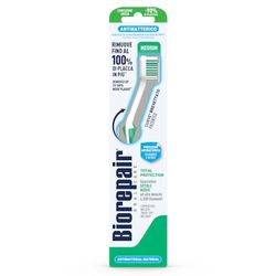 Biorepair , brosse à dents à protection totale, antibactérienne, testée cliniquement, avec poils moyens, forme incurvée brevetée, inhibe la croissance bactérienne jusqu'à 90 %, élimine jusqu'à 100 % de la plaque