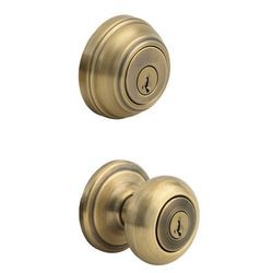 Kwikset Juno 99910-033 - Pomo de puerta de entrada con llave y cerrojo de un solo cilindro con protección antimicrobiana Microban con seguridad SmartKey en latón antiguo