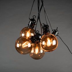 Konstsmide 4159-800SP - Catena luminosa a LED a energia solare, con telecomando e cavo USB, 10 lampadine/10 diodi ambrati, esterni, 2 batterie al litio / 1 CR2025 (incluse)