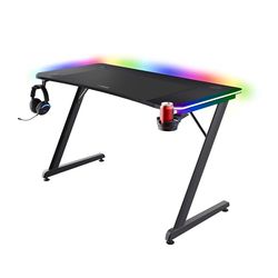 Trust Gaming GXT 710 Luminus Pro Mesa Gaming 120x60 con LED RGB, Cargador Inalámbrico de 10 W Integrado, 10 Modos de Color, Escritorio Gamer con Posavasos y Gancho Auriculares para Ordenador, Negro