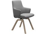 Polsterstuhl STRESSLESS "Laurel", grau (wild dove batick, walnuss), B:58cm H:92cm T:59cm, Leder BATICK: BATICK ist ein leicht korrigiertes, durchgefärbtes und genarbtes Möbelleder, bei dem die meisten Unebenheiten und Spuren in der Regel entfernt wurden., Stühle, Polsterstuhl, Low Back mit Armlehne, Größe L, mit schräggestellten Beinen in Walnuss