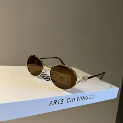 Nueva marca de moda gafas de sol ovaladas para dama Retro marco pequeño mujer hombre Metal gafas de ojos de gato sombras protección UV gafas de sol