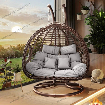 Sillón colgante de mimbre para exterior e interior, tipo cesta, con función de columpio y hamaca nido, ideal para patio y balcón doble, estilo popular en internet.