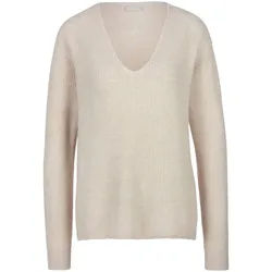 Le pull include beige