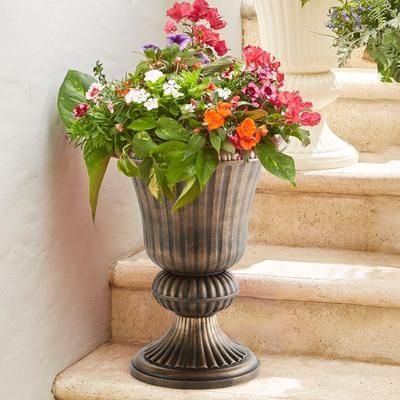 Traditional Embry Plastic Urn Planter by BrylaneHome in Bronze