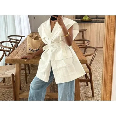 Haut ample sans manches pour femme, style utilitaire, multi-poches, avec ceinture, tendance mode, Été 2026