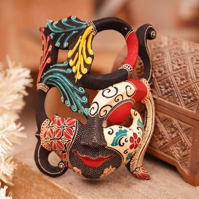 'Handcrafted Nature-Themed Batik Pule Wood Mask from Java'