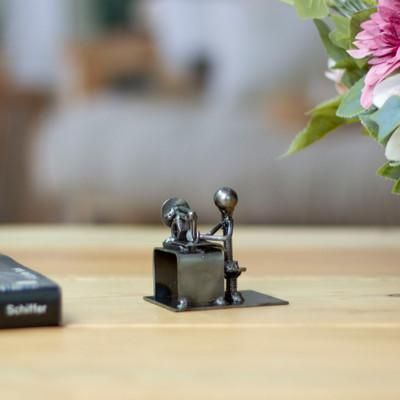 Sewing with Care,'Recycled Metal Figurine of a Seamstress with Sewing Machine'
