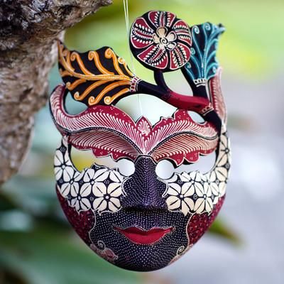 'Handcrafted Hibiscus-Themed Batik Pule Wood Mask from Java'