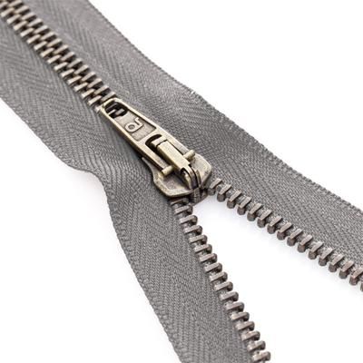 buttinette Fermeture à glissière avec glissière en métal, gris, séparable