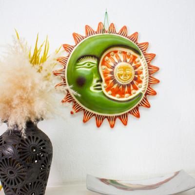 'Sun and Moon-Themed Green and Orange Ceramic Wall Art'