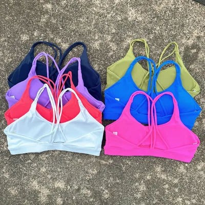 Couleur unie haute résistance Gym sous-vêtements Yoga croix femmes Fitness Sport soutien-gorge haut antichoc athlétique serré entraînement avec coussin de poitrine