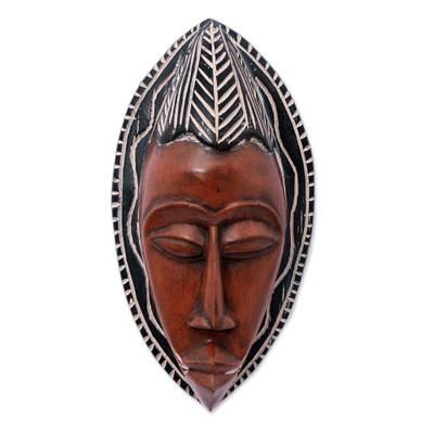 'Brown Black African Wood Wall Mask with Hand-Etched Motifs'