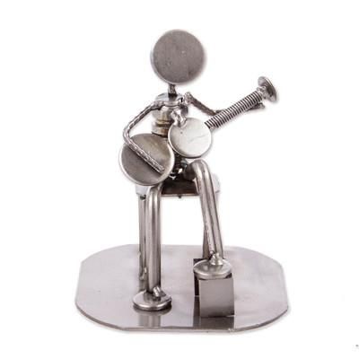 'Rustic Auto Part Eco-Friendly Sculpture of a Guitarist'