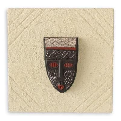African mask plaque, 'Born on Monday'