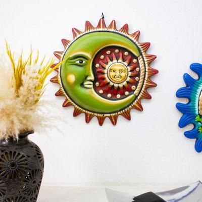 'Painted Sun and Moon-Themed Green and Red Ceramic Wall Art'