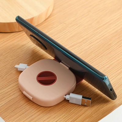 Waterproof Earphone Cable Winder & Phone Holder Pink