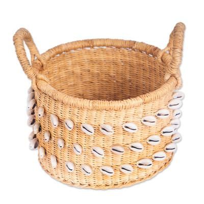 'Handwoven Natural Fiber Basket with Shell-Like Accents'