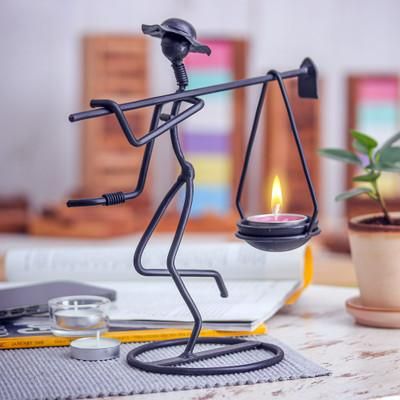 On my Way,'Modern Iron Tealight Holder of Man Carrying Weight in Black'