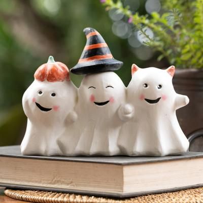 'Halloween-Themed Distressed Wood Sculpture of Three Ghosts'