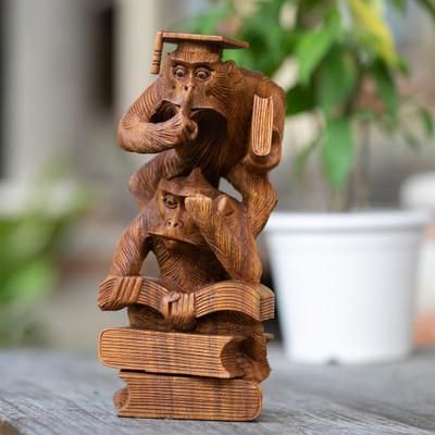 'Whimsical Hand-Carved Wood Sculpture of Orangutans Studying'