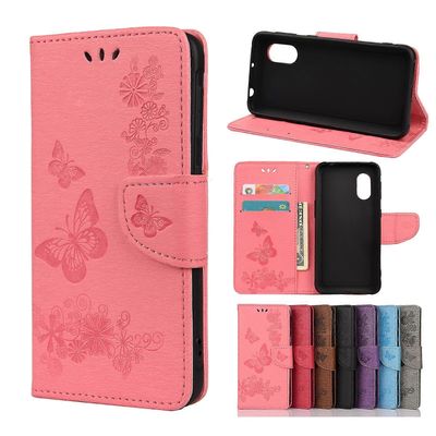 Samsung Galaxy Xcover 5 Butterflies Embossing Vaakasuora Flip Nahkakotelo pidikkeellä ja korttipaikoilla ja lompakolla Vaaleanpunainen