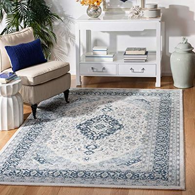 Safavieh Tapis Traditionnel pour Salon, Salle à Manger, Chambre à Coucher - Collection Isabella - Poils Courts - Crème et Bleu foncé - 122 x 183 cm