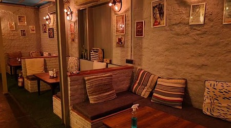 Seating Area of Routine Affaire Bar And Kitchen