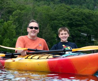 Father and Son with Wisconsin Dells Kayaking and Paddleboarding Adventure Tours