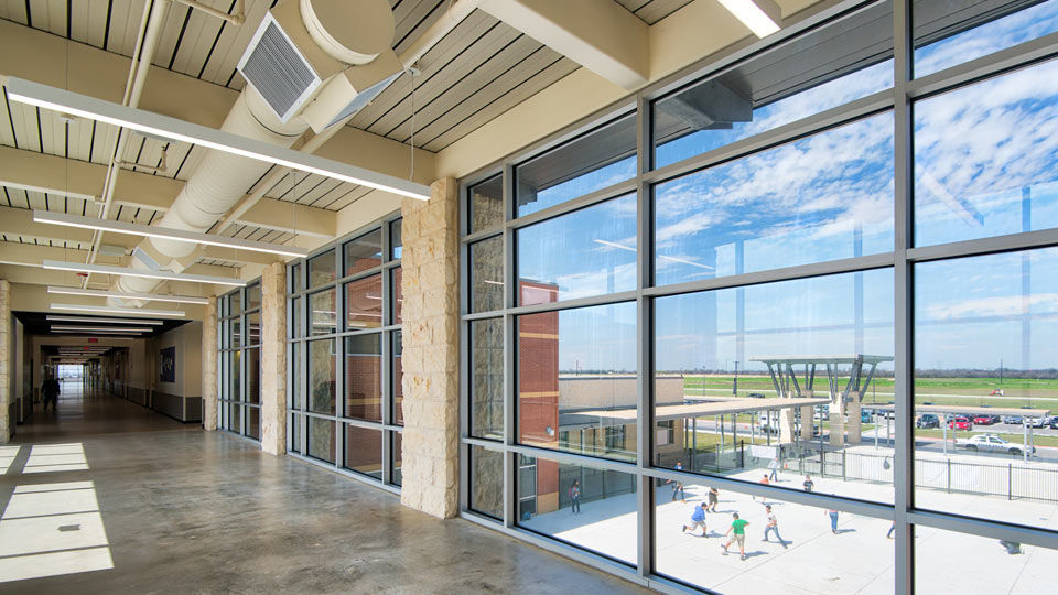 Acoustical deck in hallway of school window overlooking playground