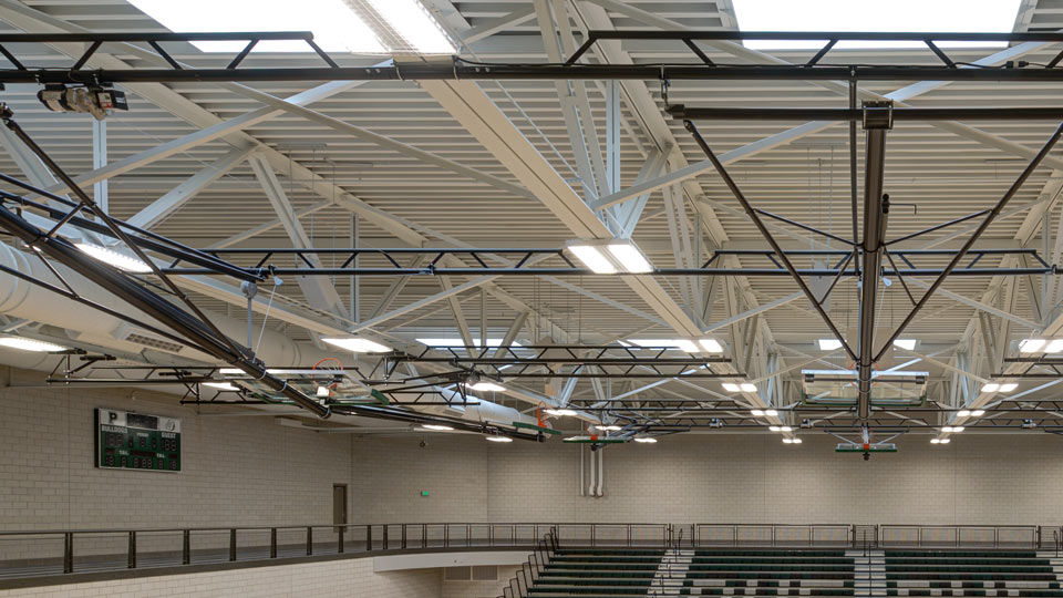 Close up of steel joist and deck ceiling over gymnasium