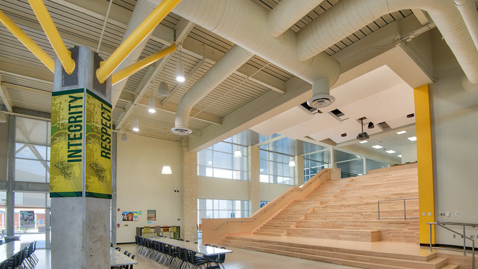 High school multi-purpose room with acoustical roof deck